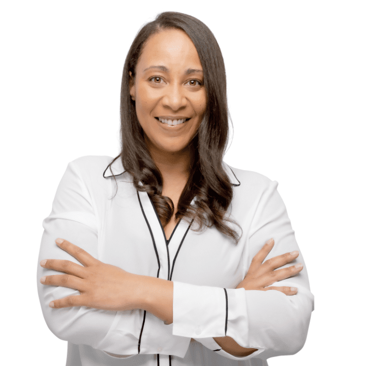 smiling Black therapist with long hair wearing a white top helping couples with premarital counseling in Atlanta.
