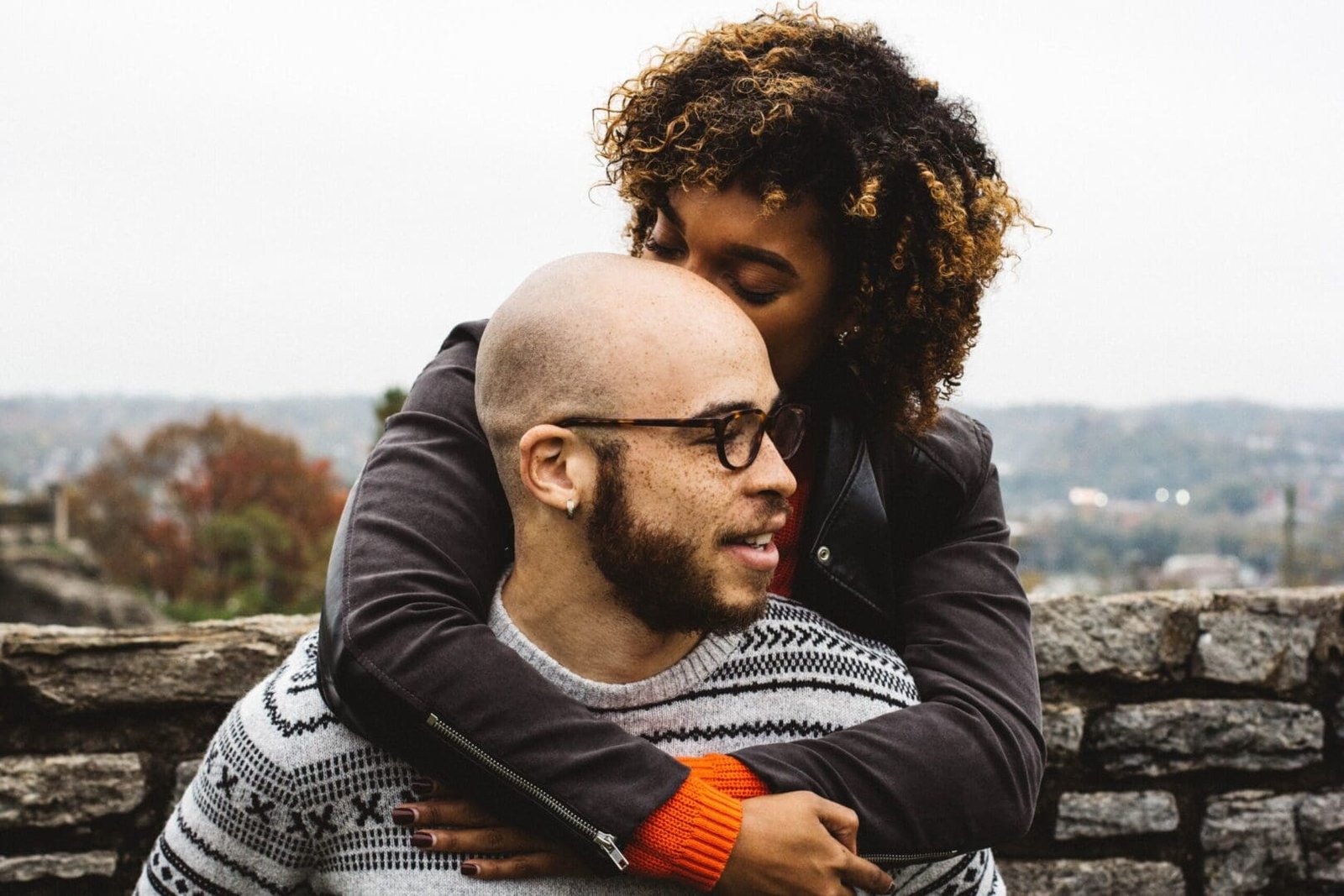 Black couple in therapy, working on managing perfectionism and stress in their relationship.