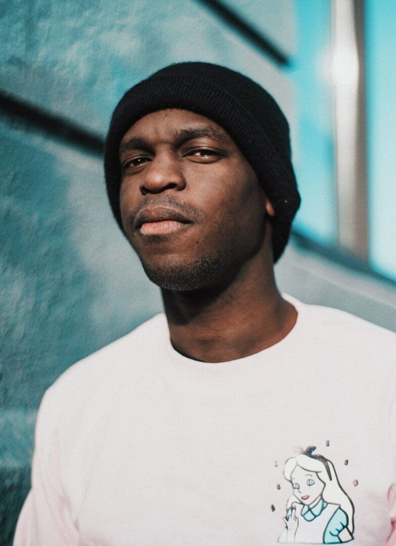 African American man practicing emotional balance by holding space for others and himself in a supportive environment.