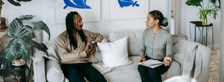 Teenage girl using a phone while lying on her bed