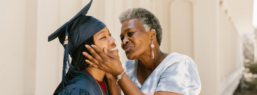Teenage girl using a phone while lying on her bed