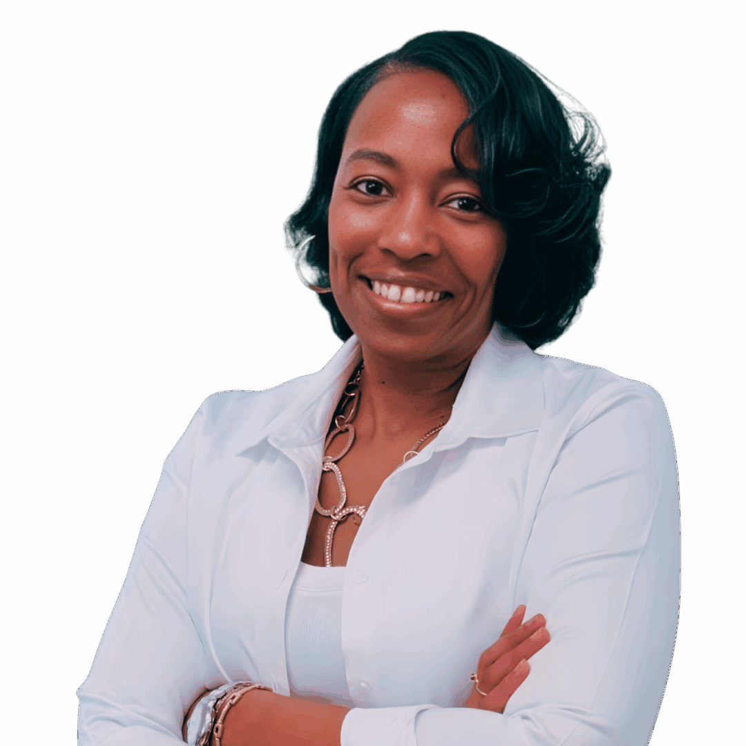 Smiling Black female therapist wearing a white button-down shirt and jeans, standing with arms crossed, representing grief counseling, therapy for women’s issues, and workplace stress support in Georgia (30080, 30339, 30067, 30213).