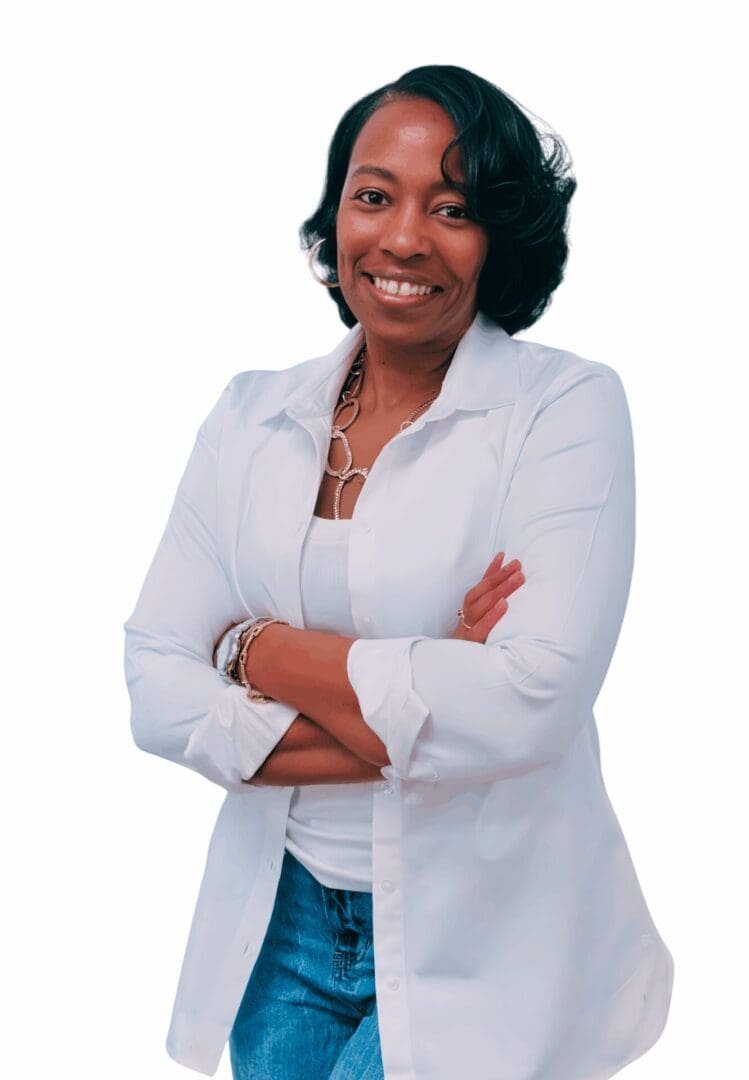 Grief Therapy, Women’s Mental Health & Workplace Stress Counseling | Georgia 30080, 30339, 30067, 30213 Smiling Black female therapist wearing a white button-down shirt and jeans, standing with arms crossed, representing grief therapy, women’s mental health counseling, and workplace stress therapy in Georgia (30080, 30339, 30067, 30213).