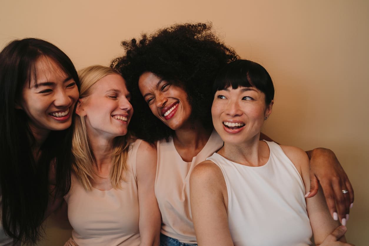 Women sharing connection and support, representing therapy for anxiety, depression, burnout, and relationship stress at an Atlanta therapy practice.